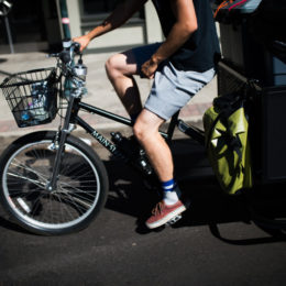 DENVER, CO - JULY 21: Scraps intern Joel Cruz bikes through the streets of Denver, Colorado to collect compost from their clients on July 21, 2017. (Photo by Gabriel Scarlett/The Denver Post)