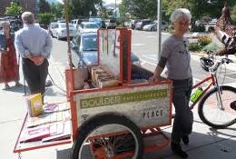 pedal truck for delivering books. Manufactured by Main Street Mobility in Colorado.