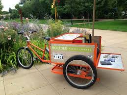 pedal truck for delivering books. Manufactured by Main Street Mobility in Colorado.