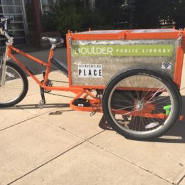 Boulder Public Library goes outside with their new library trike! Vehicle made by Main Street Mobility.